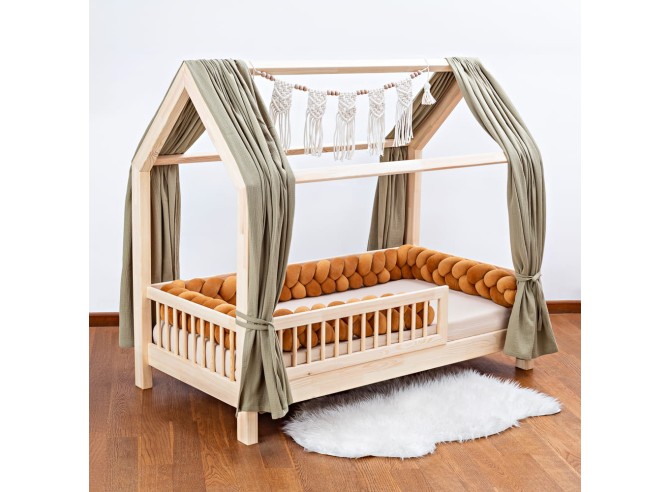 Bed with brown braided bumper